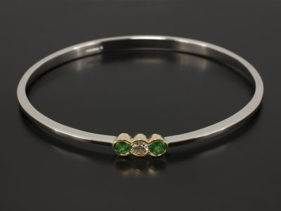 18kt White and Yellow Gold Rub over Set Emerald and Diamond Bangle, Round Brilliant Cut Diamond 4mm and Emerald 4mm