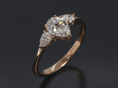 Ladies Diamond Trilogy Engagement Ring, 18kt Rose Gold Claw Set Design, Pear Cut Diamond Centre Stone 0.70ct, D Colour, VS2 Clarity, Pear Cut Diamond Side Stones 0.26ct (Total)