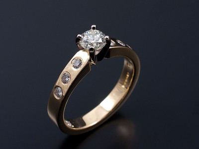 18kt Two Tone Gold Band and Setting with Round Brilliant 0.42ct G Colour VS2 Clarity Centre Stone and Round Brilliants 0.21ct (7) G Colour VS Clarity Secret Set into Band