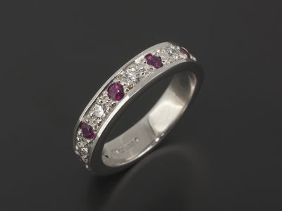 18kt White Gold Wedding / Eternity Ring with Pavé Set Round Brilliant Cut Diamonds and Rubies.