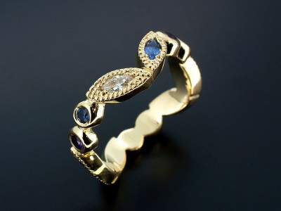 18kt Yellow Gold Rub Over and Filigree Design Comprising Marquise Sapphires and Diamonds and Round Sapphires and Amethysts.