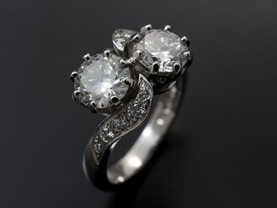Round Brilliant 2 x 1.02ct G SI2 in a Platinum Twist Design with Pave Set Shoulders.