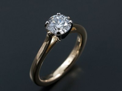 Round Brilliant 0.78ct E VS2 Excellent Proportions, Symmetry and Polish in a 4 Claw Platinum and 18kt Yellow Gold Setting.