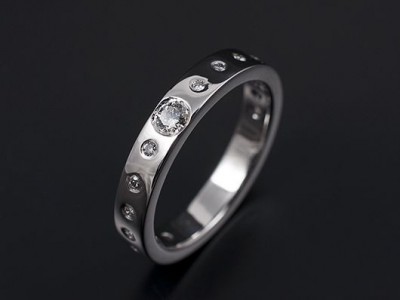 Secret Set Wedding / Eternity Ring Comprising 1 x 0.10ct F VS and 22 x 1.2mm Round Brilliant Diamonds. Hand Made in Platinum.