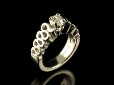 White Gold 18kt Wave Engagement Ring with a 0.51ct E VS2 Round Brilliant Diamond