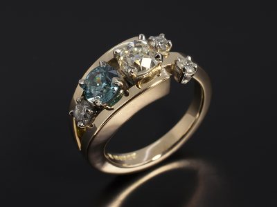 Palladium and 9kt Yellow Gold Split Band Dress Ring with Round Brilliant Cut Diamonds and Blue Zircon.
