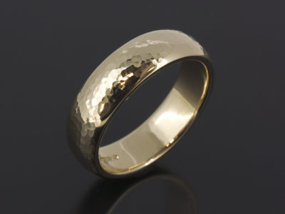 9kt Yellow Gold 6mm Width Court Shaped Gents wedding Ring with a Hammered and Polished Finish.