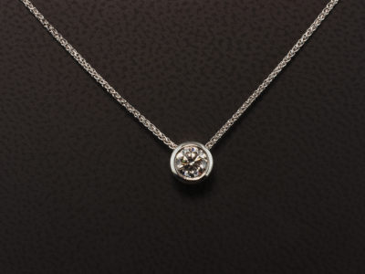 9kt White Gold Rub Over Set Solitaire Diamond Pendant with Passing Through Chain Design, Round Brilliant Cut Diamond 0.59ct E Colour, VS1 Clarity Triple EX, on Spiga Chain