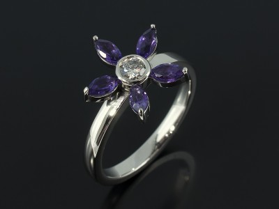 Marquise Cut Amethysts and Round Brilliant Diamond in a Palladium Floral Style Design.