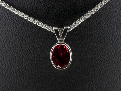 9kt White Gold Rub over Set Blood Orange Sapphire Pendant, Oval Cut Blood Orange Sapphire 1.05ct with Split Bale Detail on a Spiga Chain