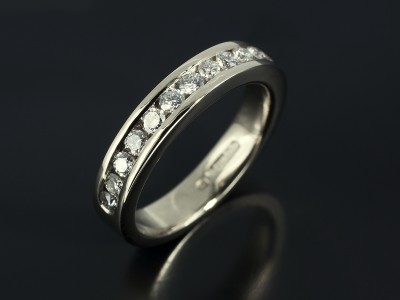 Channel Set Half Eternity Ring with 0.70ct Total F VS Round Brillian Diamonds in 18kt White Gold.
