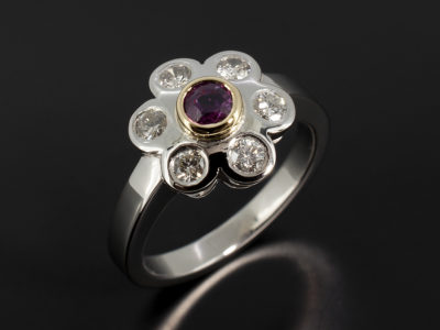 Palladium and 18kt Yellow Gold Floral Cluster Design Dress Ring with 0.29ct Ruby and Round Brilliant Cut Diamonds 0.38ct Total.