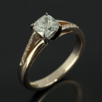 Cushion Cut 0.60ct G Colour SI1 Clarity 18kt White and Rose Gold Setting with Diamond Set Split Shoulders Design.