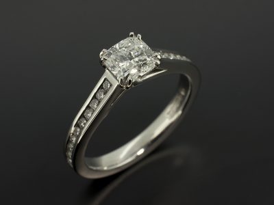 Ladies Diamond Engagement Ring, Double Claw Set Platinum Design, Cushion Cut Diamond 0.91ct, E Colour, VS2 Clarity, Round Brilliant Cut Diamond Channel Set Shoulders
