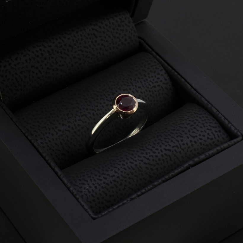 Pigeon Blood Round Ruby 0.81ct in a 9kt Rose Gold Rub Over Setting with Platinum Band Ladies Ring