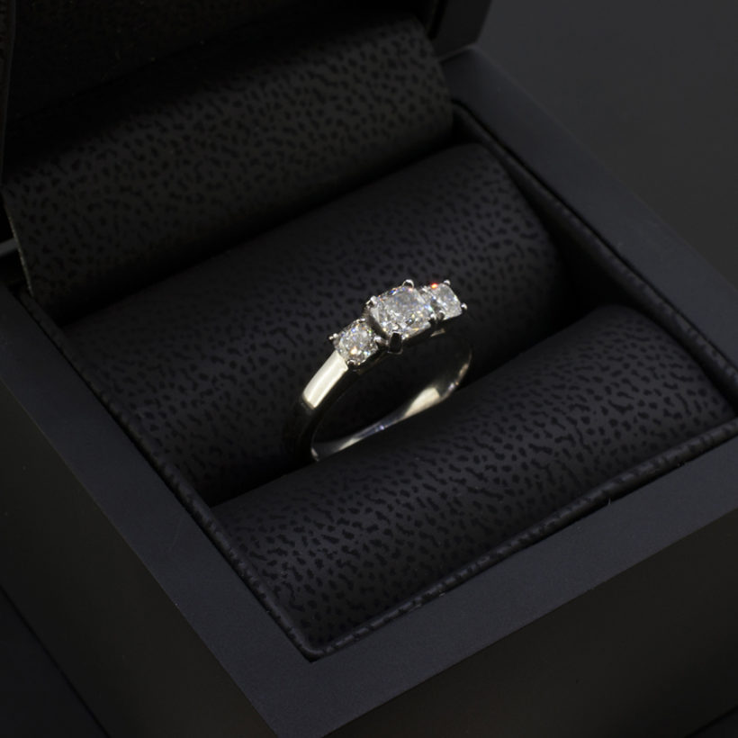 Cushion Cut 0.51ct D Colour VS2 Clarity EXVG with Cushion Cut Side Diamonds 0.40ct Total in a Platinum Claw Set Trilogy Design Engagement Ring