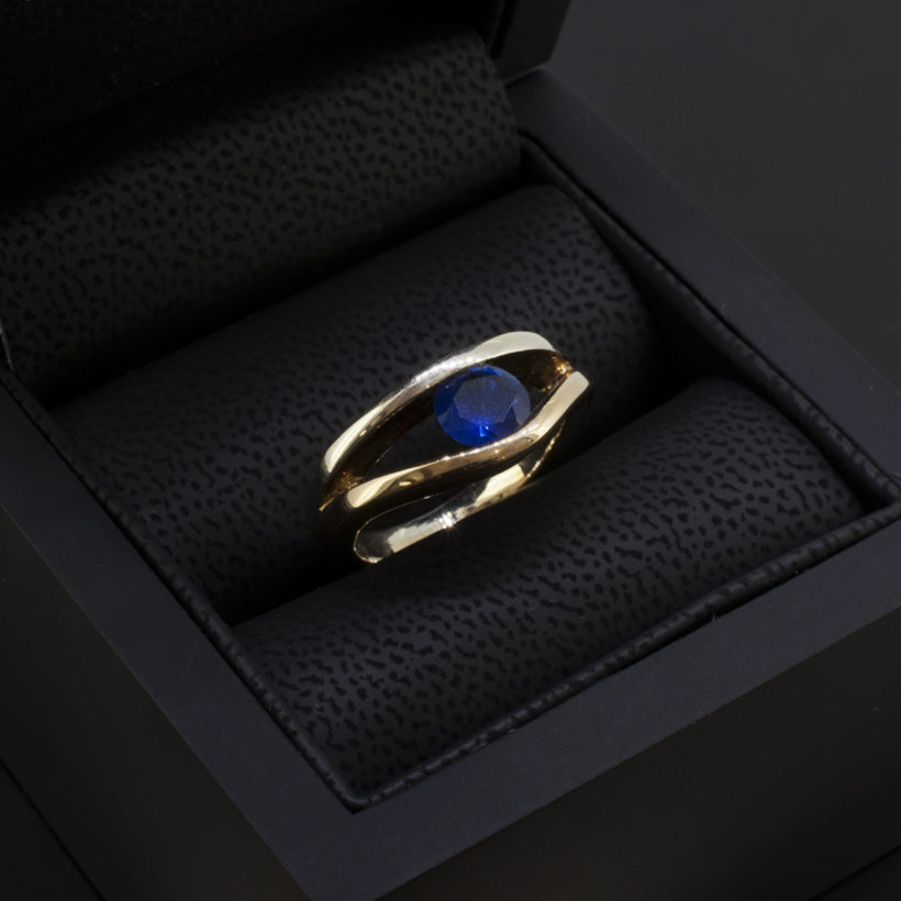 Round Brilliant Cut Sapphire 1.05ct in a Tension Set 9kt White and Yellow Gold Design Ladies Ring