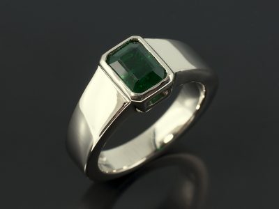 Emerald 1.09ct in an 18kt White Gold Rub Over Setting with Tapered Band.