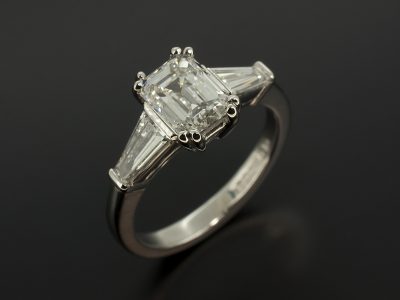 Ladies Trilogy Diamond Engagement Ring, Platinum Claw Set Design, Emerald Cut Diamond Centre Stone 1.20ct, E Colour, VS1 Clarity, Tapered Baguette Cut Diamond Shoulders, F Colour, VS Clarity