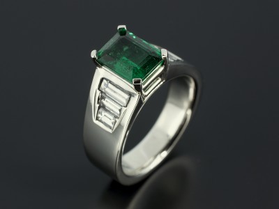 Platinum 4 Claw and Channels Set Design with Emerald Cut Emerald 1.65ct and 6 x Baguette Cut Diamonds 0.88ct Total.