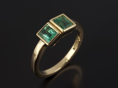 Baguette Cut Emeralds 0.40ct and 0.45ct in an 18kt Yellow Gold Rub Over Set Contemporary Design.