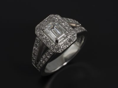 Ladies Diamond Halo Engagement Ring, Platinum 4 Claw and Pavé Set Split Band Design, Emerald Cut Diamond Centre Stone 0.91ct, D Colour, VVS2 Clarity, Ex Polish, VG Symmetry, Round Brilliant Cut Diamond Halo and Shoulder