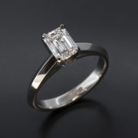 Emerald Cut 0.93ct E Colour VS1 Clarity in a 4 Claw Platinum Setting with Knife Edged Split Shoulders Band.