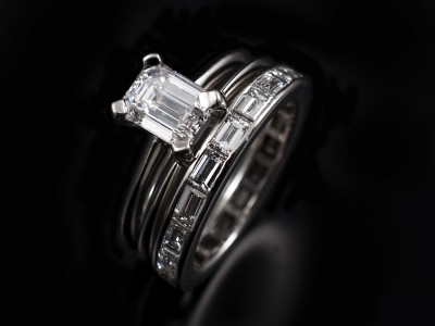 Ladies Solitaire Diamond Engagement Ring, Platinum 4 Claw Set Design, Emerald Cut Diamond 1.01ct, D Colour, VVS2 Clarity, Shown with Integrated Spacer Wedding Ring and Full Diamond Set Eternity Ring