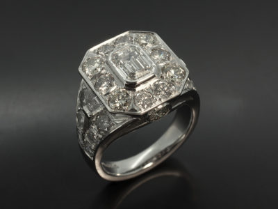 Ladies Diamond Halo Engagement Ring, Platinum Rub over and Pavé Set Design in Antique, Vintage Style, Emerald Cut Diamond Centre Stone 1.01ct, D Colour, SI1 Clarity, Ex Polish, Ex Symmetry, Split Band Detail with Pavé Set Round Brilliant Cut and Step Cut Trapezium Cut Diamonds