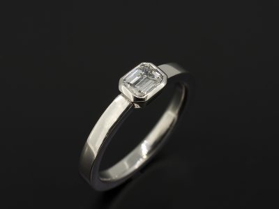 Ladies Solitaire Diamond Engagement Ring, 18kt White Gold Rub over Set Design, Emerald Cut Diamond 0.35ct, F Colour, VS Clarity