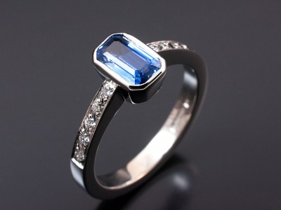 Emerald Cut Sapphire 0.89ct with Pave Set Shoulders in an 18kt White Gold Rub Over Setting