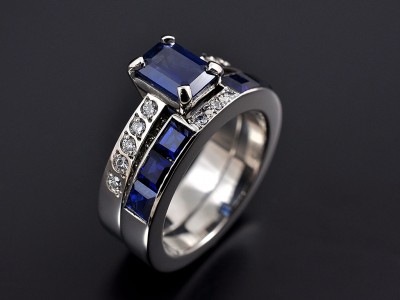 Emerald Cut Sapphire 1.34ct with Pave Set Diamond Shoulders and Fitted Sapphire Channel Set Wedding Ring. Both Hand Made in Palladium.