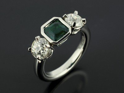 Emerald Square Step Cut 0.58ct with 2 x 0.70ct Round Brilliant Diamonds in a Palladium Trilogy Design