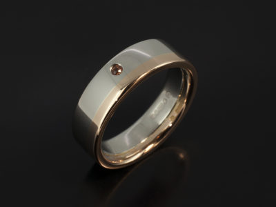 Gents Platinum and 18kt Rose Gold Two Tone Wedding Ring. 6mm Width with Orange Secret Set Sapphire.