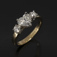 Ladies Trilogy Diamond Engagement Ring, Platinum and 18kt Yellow Gold Design, Heart Shape Diamond 0.75ct Centre Stone, Round Brilliant Cut Diamond Side Stones 2 x 0.12ct F SI