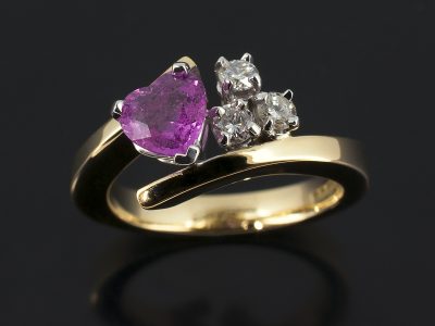 Heart Shaped Pink Sapphire 0.88ct with Round Brilliant Cut Diamonds 0.18ct Total in a 9kt Yellow and white Gold Setting.