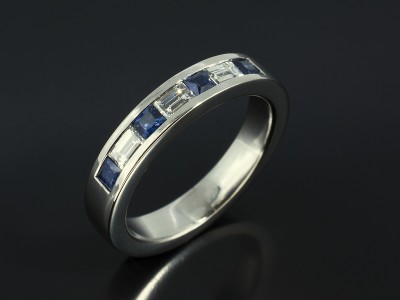 Ladies Channel Set Platinum Diamond Baguette and Princess Cut Sapphire Wedding Ring.