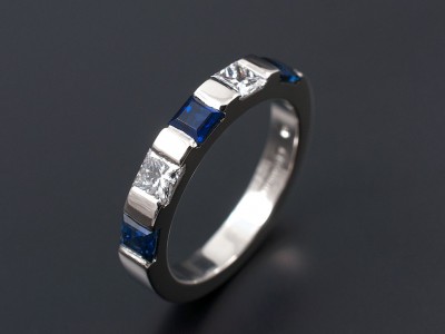 Ladies Wedding Eternity Ring Comprising 2 x 0.10ct F VS Princess Cut Diamonds and 3 x 3mm Square Ceylonese Sapphires. Hand Made and Bar Set in Palladium.