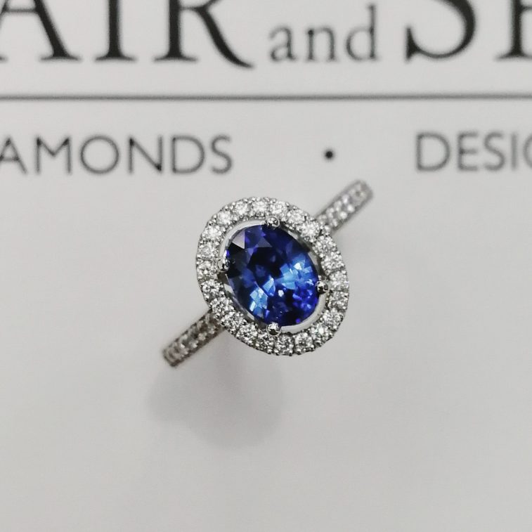 Dress / Engagement Ring Oval Ceylon Sapphire 1.25ct with Round Brilliant Cut Diamonds 0.25ct Total in a Platinum Halo Design.