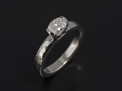 Ladies Solitaire Diamond Engagement Ring, Platinum Part Rub over Set Design, Oval Cut Diamond 0.50ct, D Colour, SI1 Clarity, EX Polish, VG Symmetry, Hammered Finish Detail