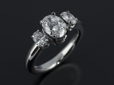 Ladies Trilogy Diamond Engagement Ring, Palladium Claw Set Design, Oval Cut Diamond Centre Stone 0.90ct, D Colour, VS2 Clarity, 2x Oval Cut Diamond Side Stones 0.34ct, F Colour, VS Clarity
