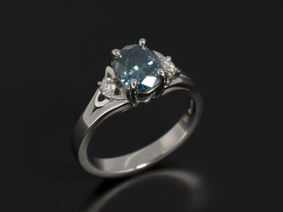 Oval Cut Blue Diamond 1.04ct Claw Set In Platinum with Round Brilliant Cut Diamonds 0.08ct (2) in a Celtic Design