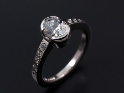 Ladies Diamond Engagement Ring, Platinum Half Rub over and Bead Set Design, Oval Cut Diamond 1.01ct, D Colour, VS2 Clarity, Bead Set Round Brilliant Cut Diamond Shoulders