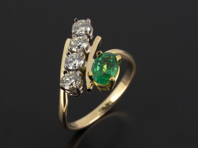 Oval Cut Emerald 0.63ct with 4 x 0.20ct Round Brilliant Diamonds in an 18kt Yellow Gold Twist Design.