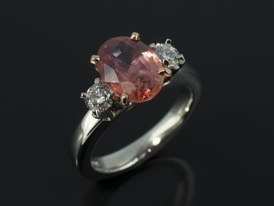 Oval Peach Sapphire 2.67ct with 2 x Round Brilliant Cut Diamonds 0.36ct Total F Colour SI Clarity in an 18kt Rose Gold and Platinum Setting.