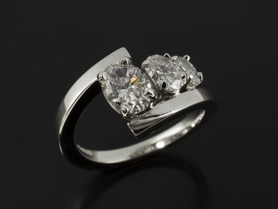 Ladies Trilogy Diamond Engagement Ring, Platinum Claw Set Twist Design, Oval Cut Diamond Centre Stone 0.90ct, D Colour, SI1 Clarity, Oval Cut Diamond Side Stones 0.42ct, 0.20ct, F Colour, VS Clarity