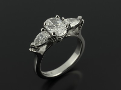 Ladies Trilogy Diamond Engagement Ring, Palladium Claw Set Design, Oval Cut Diamond Centre Stone 1.06ct, D Colour, VS1 Clarity, Pear Cut Diamond Side Stones 0.65ct Total, F Colour, VS Clarity Minimum