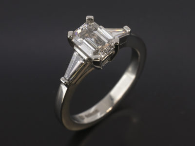 Ladies Trilogy Diamond Engagement Ring, Platinum Claw Set Design, Emerald Cut Diamond Centre Stone 0.92ct, D Colour, SI1 Clarity, EXVG, Tapered Baguette Cut Diamond Side Stones 0.27ct Total