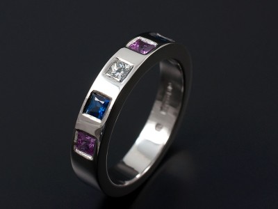 Palladium Eternity Wedding Ring Consisting of a 0.10ct F VS Princess Cut Diamond, 2 x Blue Square Sapphires and 2 x Pink Square Sapphires Secret Set into Band.