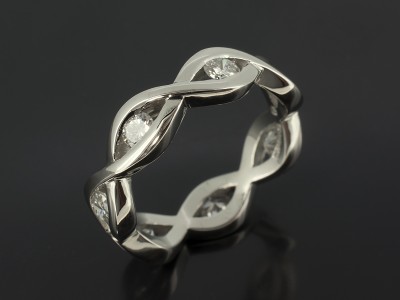 Palladium Seven Diamond Eternity Ring in a Swirl Tension set Design.